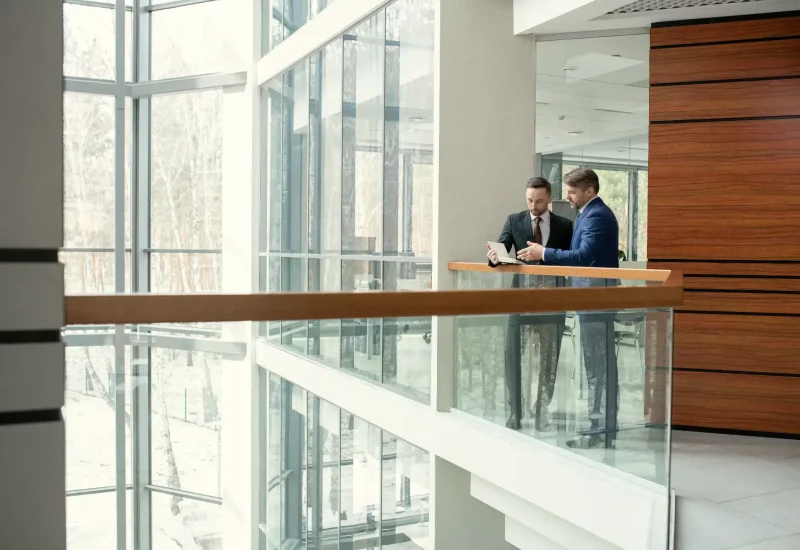 professional-men-reviewing-documents-flipped